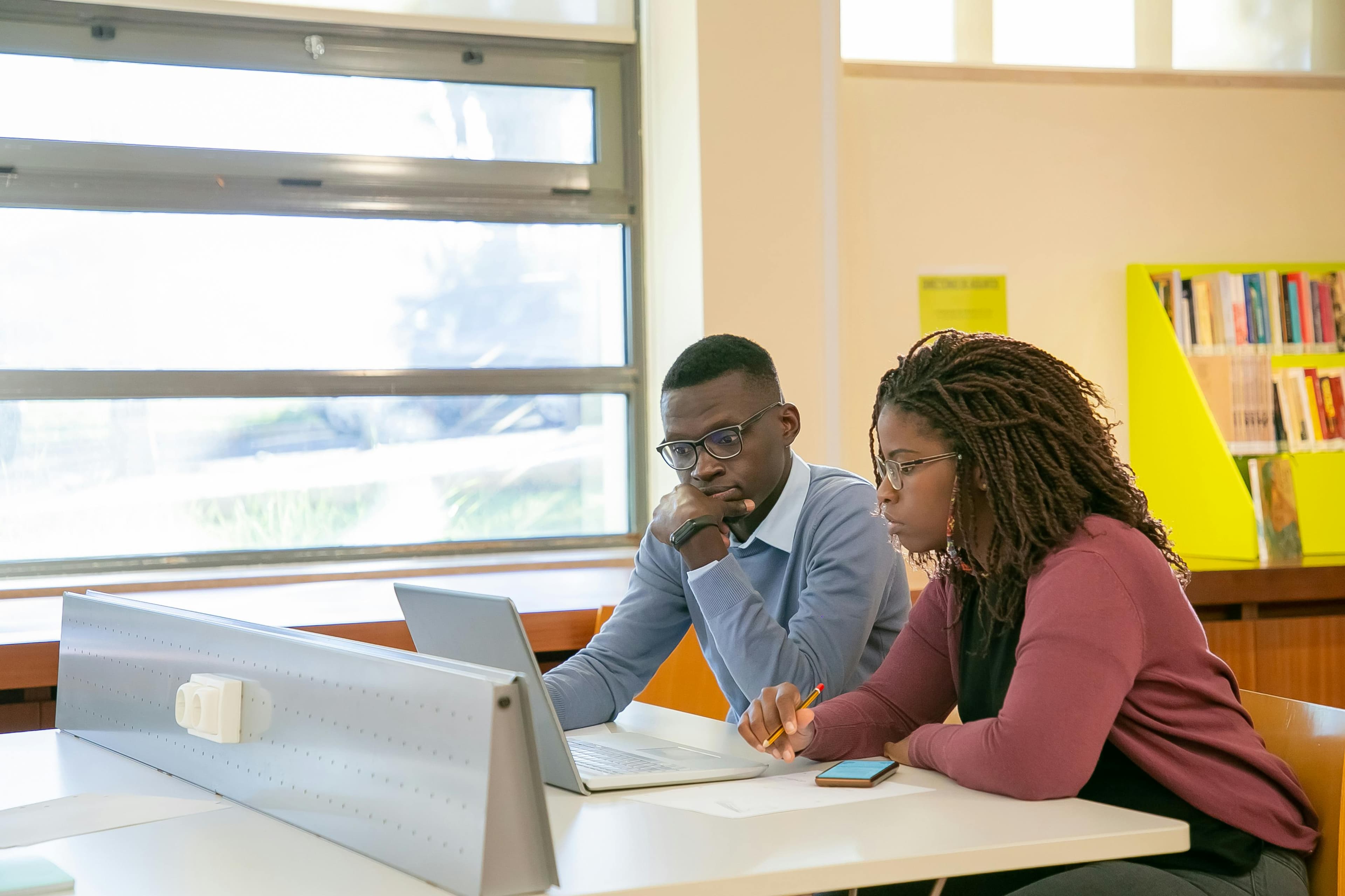 Students studying together in a library